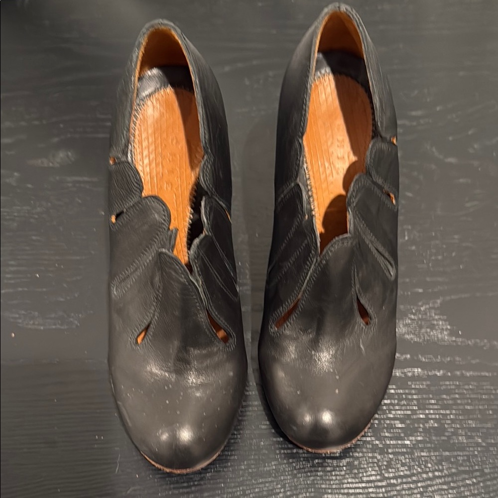 Chie Mihara Black Flats with Timeless Elegance